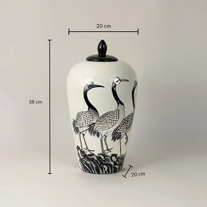 White ceramic decorative jar with black crane artwork showing product dimensions for elegant contemporary home decor displays.