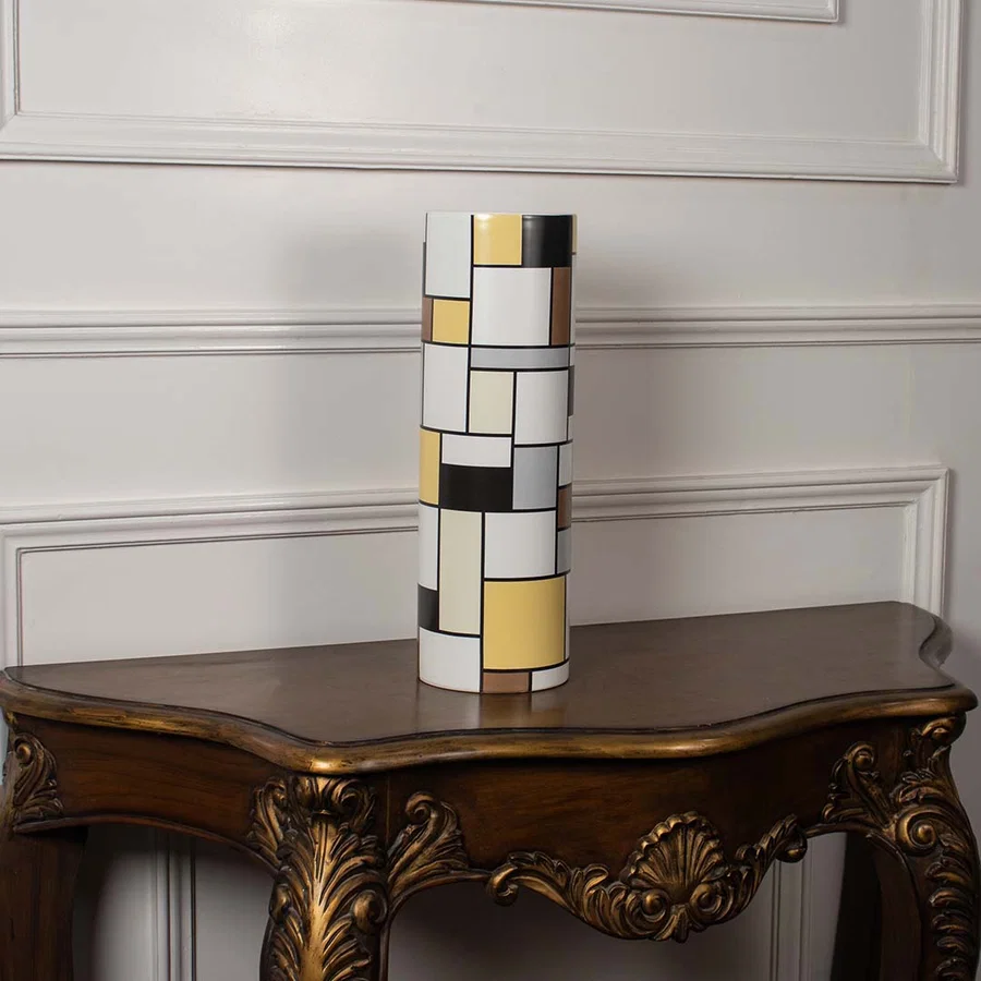 White ceramic sculptural vase displayed on a clean background emphasizing its modern fluid form for elegant interior styling.