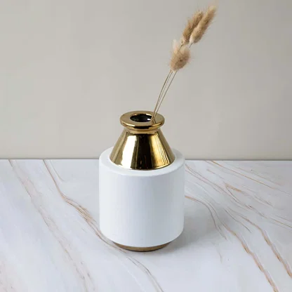 Contemporary white and gold ceramic vase displayed in a minimal lifestyle setup perfect for enhancing stylish home interiors.