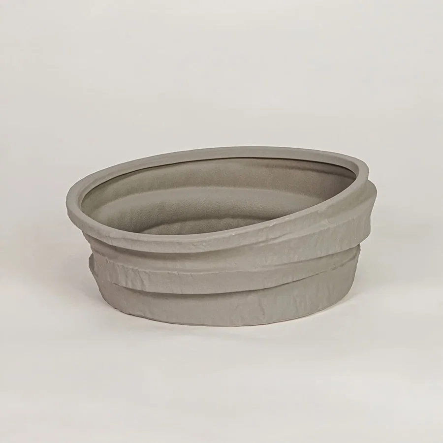 Grey ceramic decorative bowl with layered textured design for modern tabletop shelf and console decor placement.