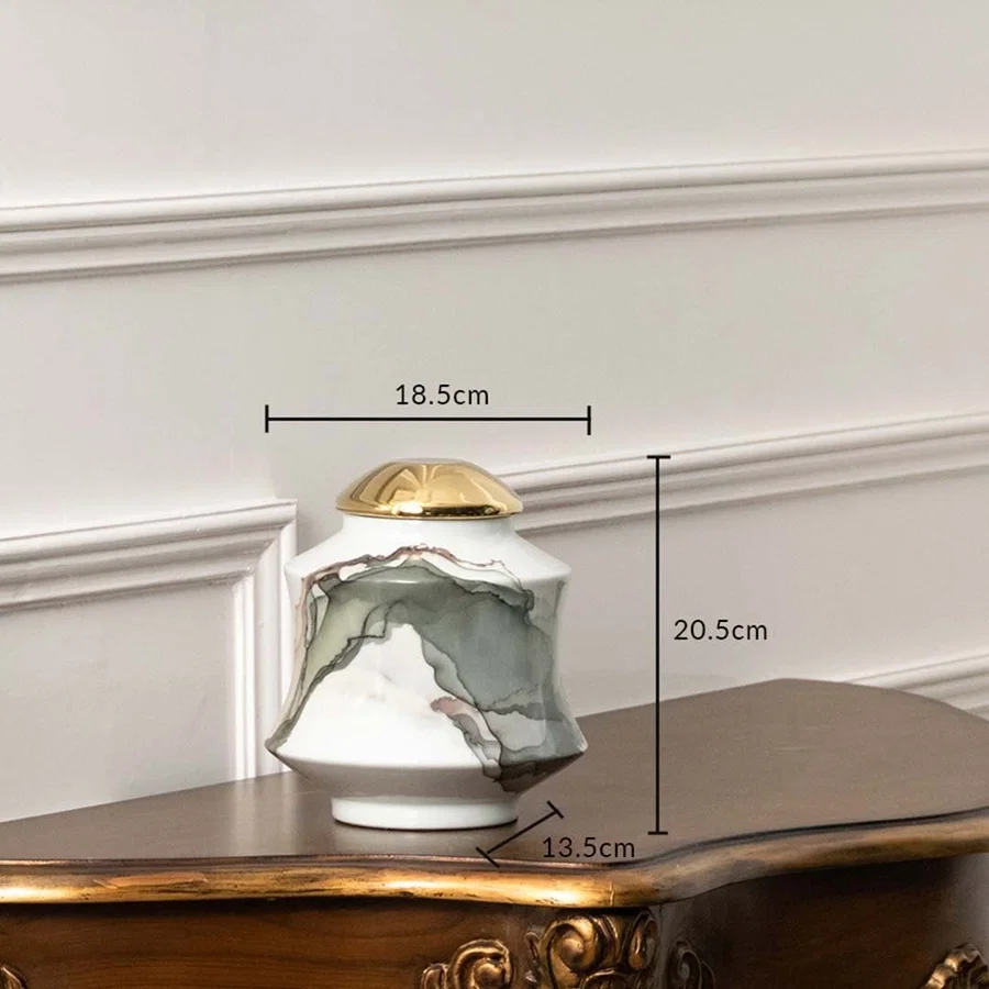 White ceramic jar with gray abstract swirl and gold lid shown with dimensions 20.5 cm height and 18.5 cm width.