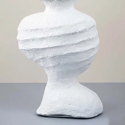 White ceramic decorative vase with layered sculptural texture for artistic shelf styling and modern home decor displays.