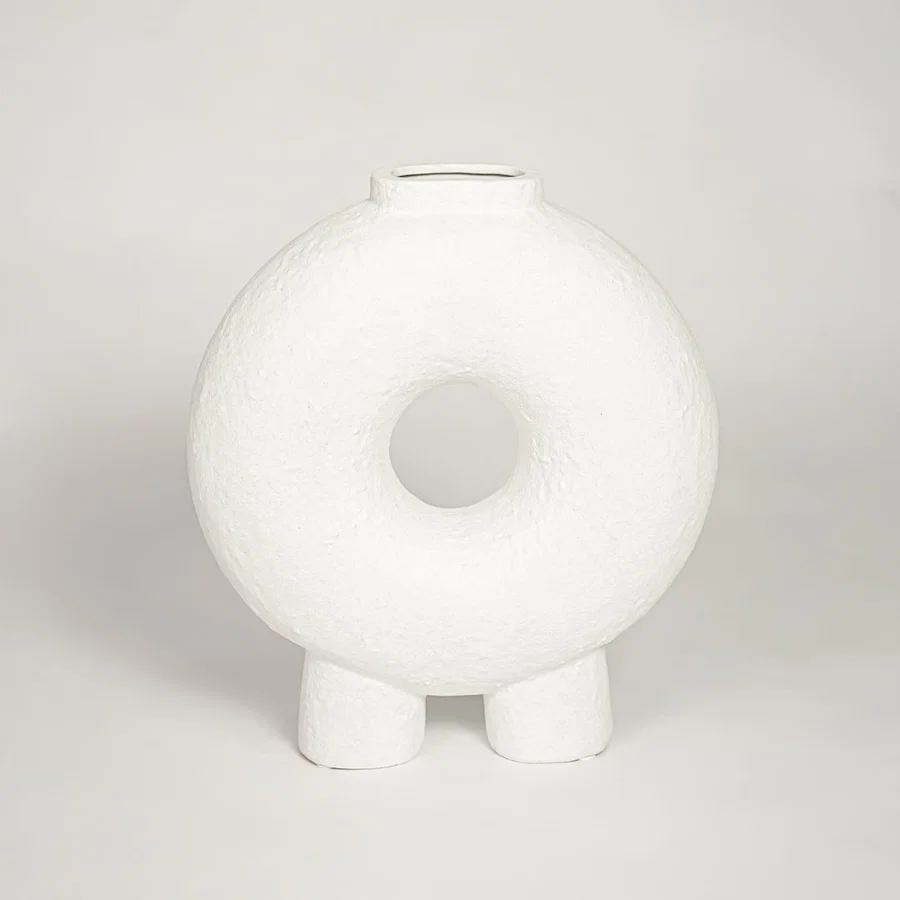 Contemporary white ceramic decorative vase with circular cutout perfect for entryway table living room or dining decor display.
