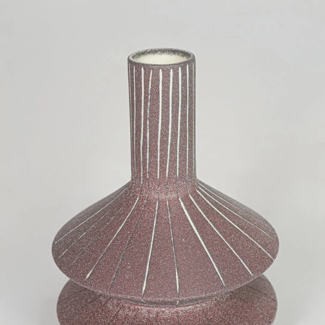Closeup pink textured ceramic vase surface detail modern decorative flower vase for table shelf console decor.