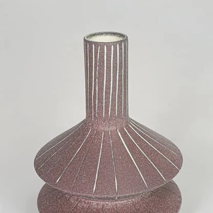 Closeup pink textured ceramic vase surface detail modern decorative flower vase for table shelf console decor.