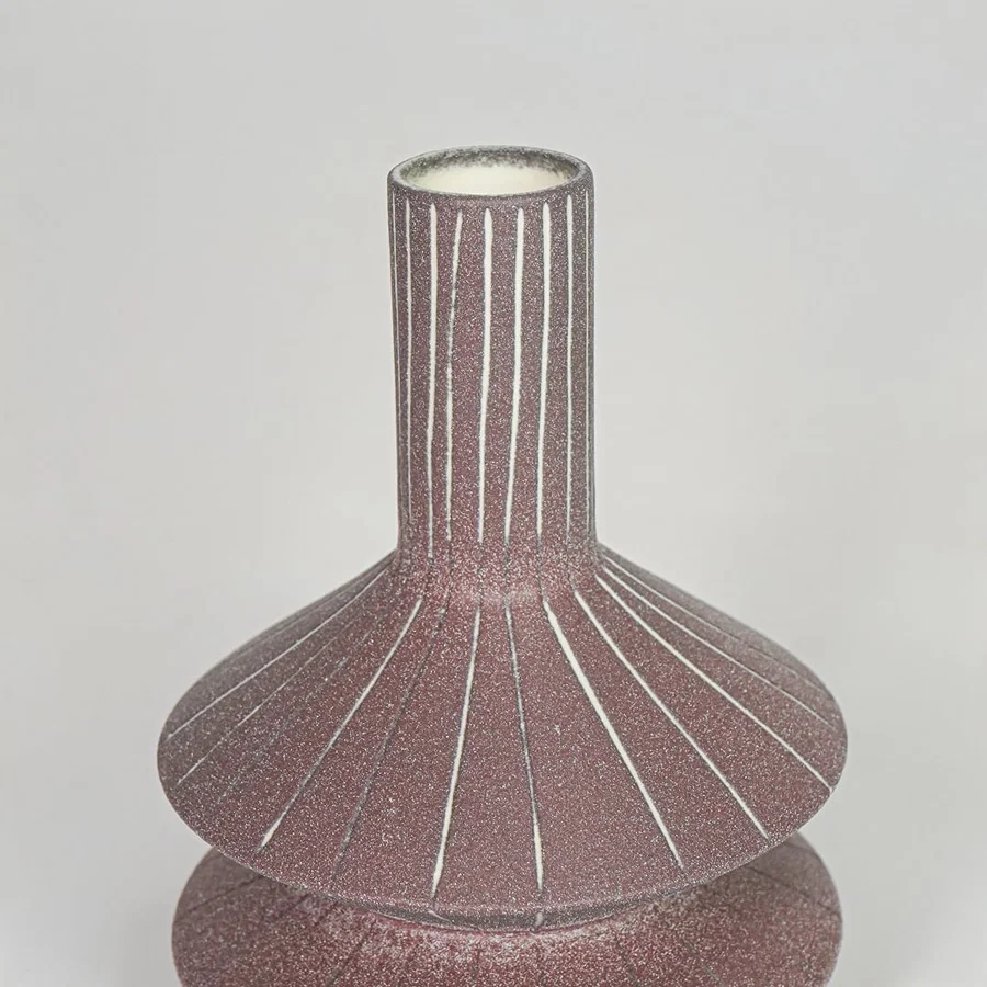 Closeup pink textured ceramic vase surface detail modern decorative flower vase for table shelf console decor.