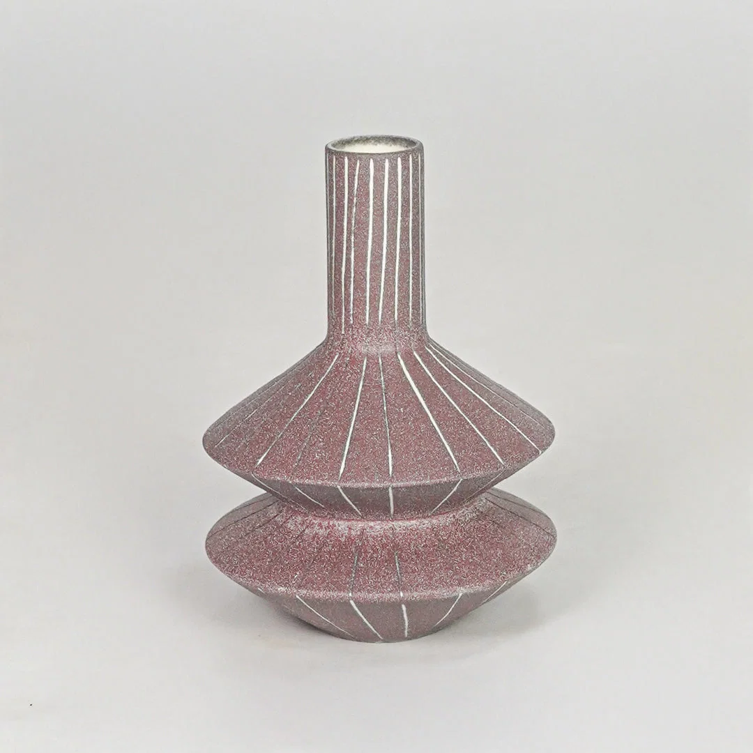 Matte terracotta tiered geometric vase with fine lines for modern home decor and artistic tabletop centerpiece.