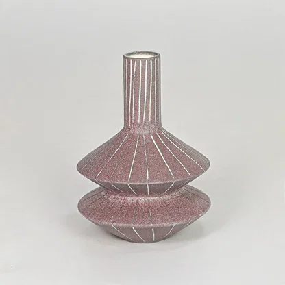 Matte terracotta tiered geometric vase with fine lines for modern home decor and artistic tabletop centerpiece.