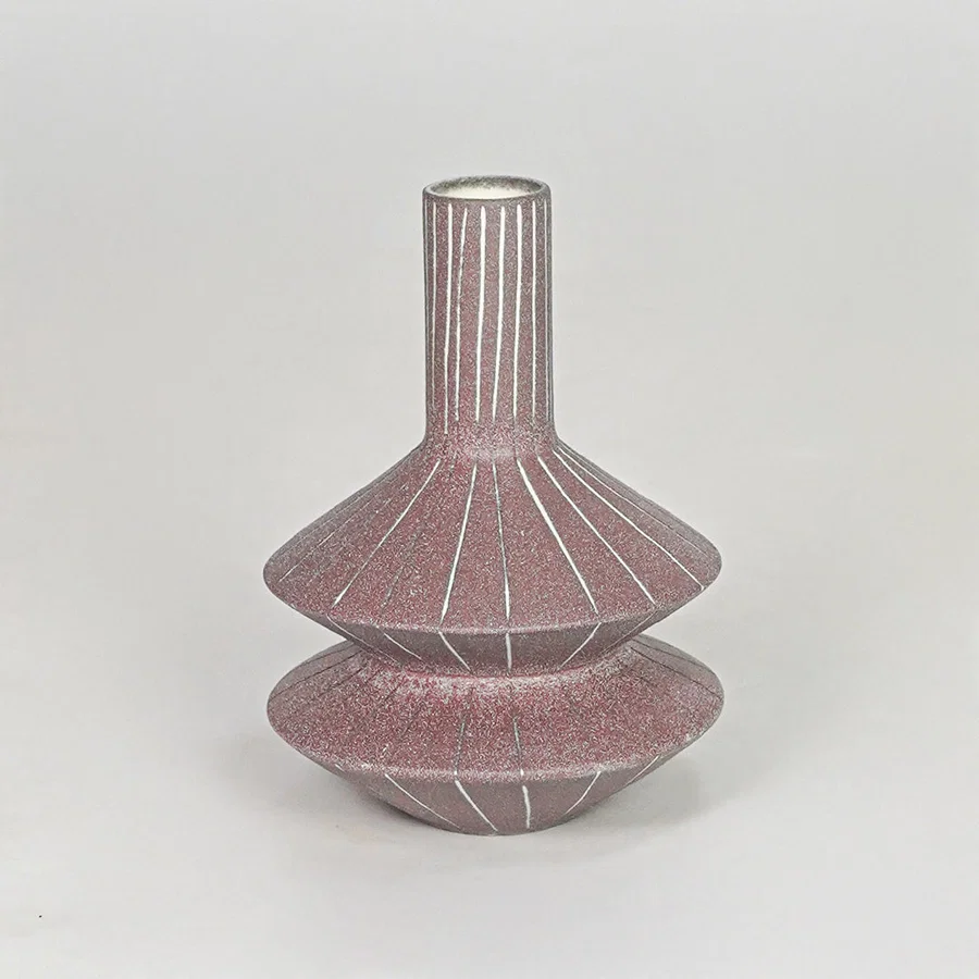 Matte terracotta tiered geometric vase with fine lines for modern home decor and artistic tabletop centerpiece.