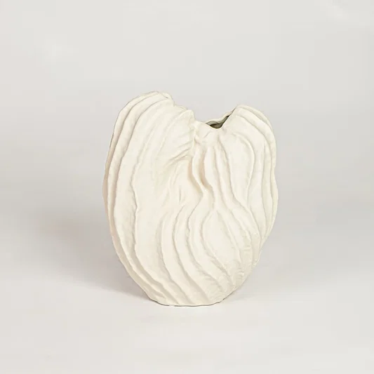 White flutter ceramic vase with sculpted organic design isolated on white background for elegant home decor display.