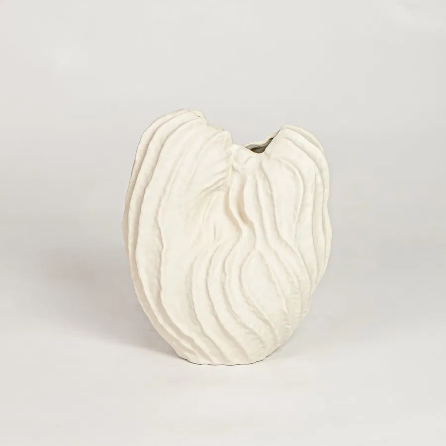 White flutter ceramic vase with sculpted organic design isolated on white background for elegant home decor display.
