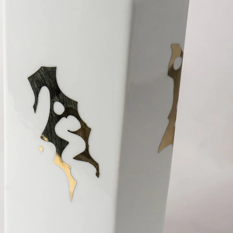 White ceramic jar with black abstract horse artwork in a close-up view ideal for modern console décor and stylish home accents.