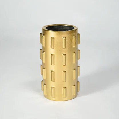 Gold metal planter pot for luxury coffee table placement and modern indoor decor styling accent display piece.