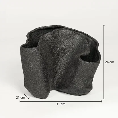 Black textured metal decorative vase measuring 24 cm height 31 cm width and 21 cm depth ideal for modern interior decor styling.