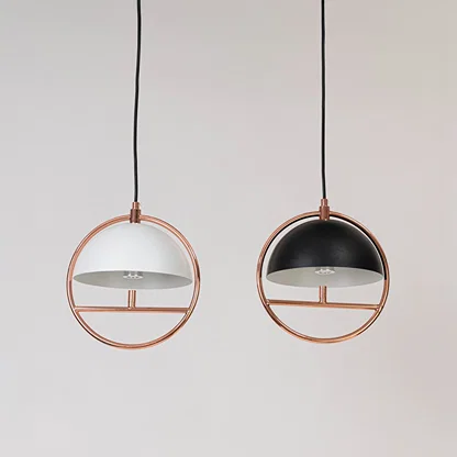 Black and white metal pendant lights showcasing elegant circular designs for modern home decor.