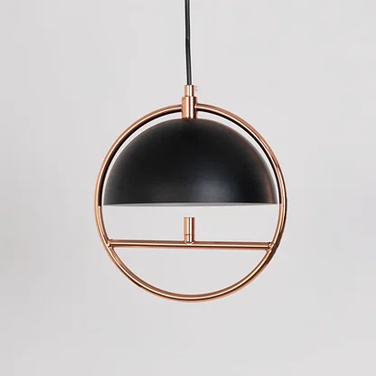 Black metal and copper pendant light with dome shade designed for modern dining room and living room decor.