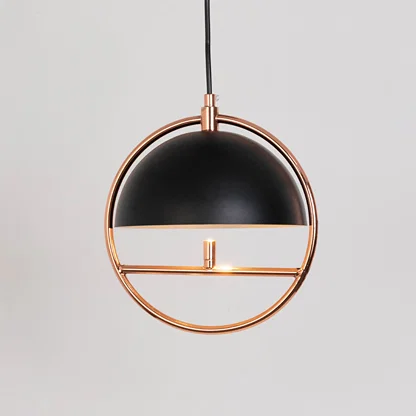 Contemporary pendant light in black and gold metal finish with circular frame for dining room or living decor lighting white background.