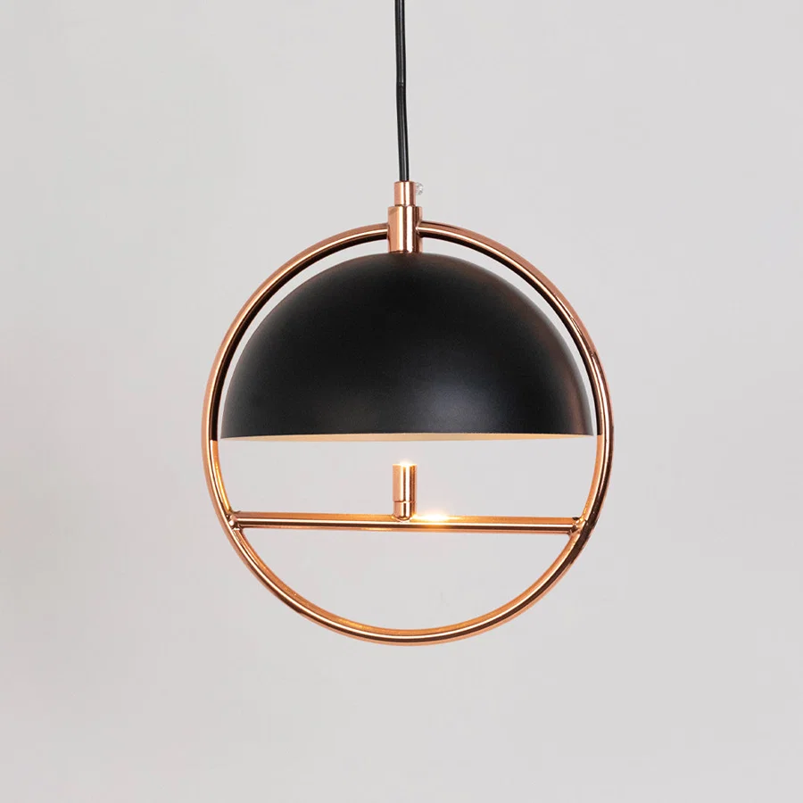 Contemporary pendant light in black and gold metal finish with circular frame for dining room or living decor lighting white background.