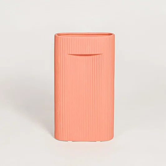 Contemporary coral ceramic flower vase with minimalist sculpted design perfect for entryway table living room decor display.
