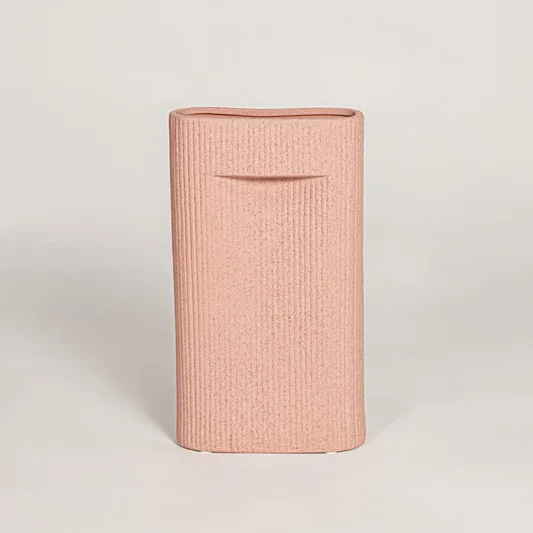 Contemporary peach ceramic flower vase with minimalist sculpted design perfect for entryway table living room decor display.
