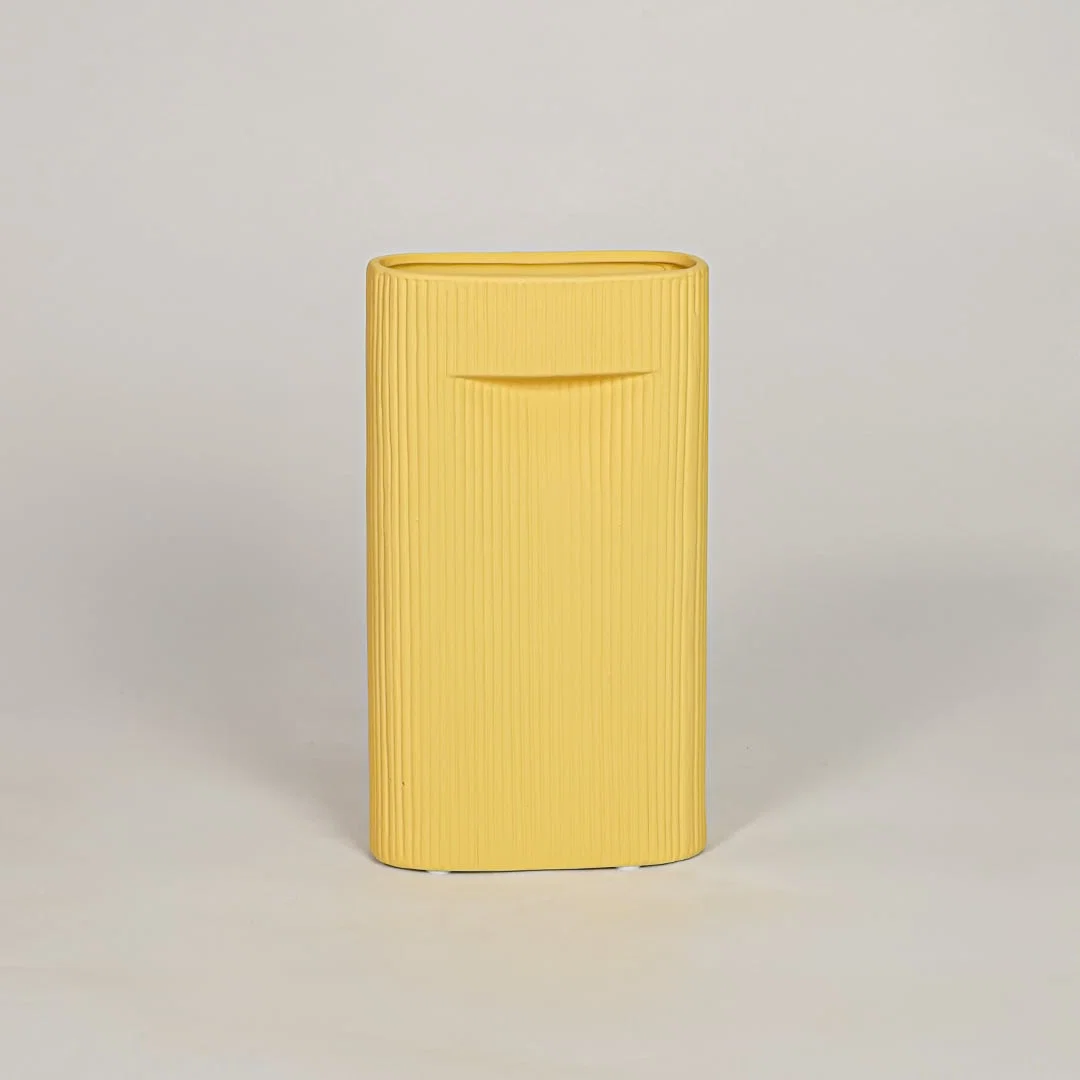 Mustard ceramic decorative vase with ribbed textured finish for modern tabletop shelf and console decor styling.