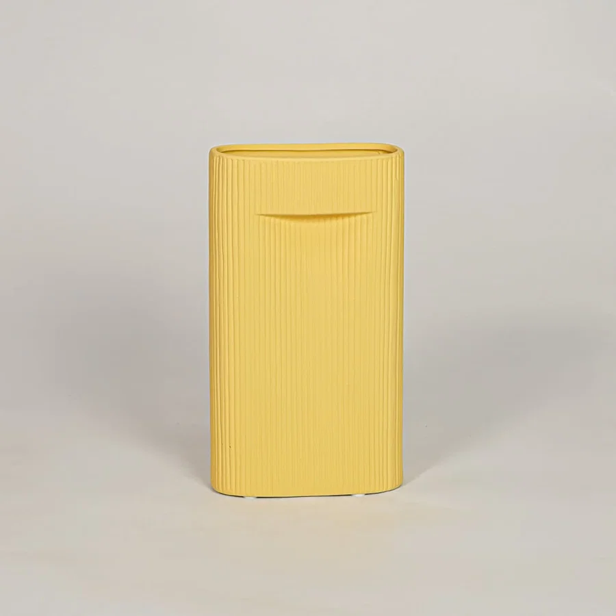 Mustard ceramic decorative vase with ribbed textured finish for modern tabletop shelf and console decor styling.