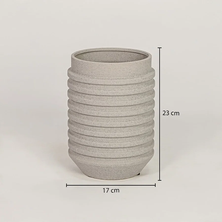 Beige ceramic decorative vase measuring 23 cm height and 17 cm width for modern tabletop decor placement.