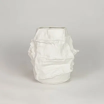 White ceramic decorative flower vase with textured finish modern vase for tabletop shelf console living room decor styling.