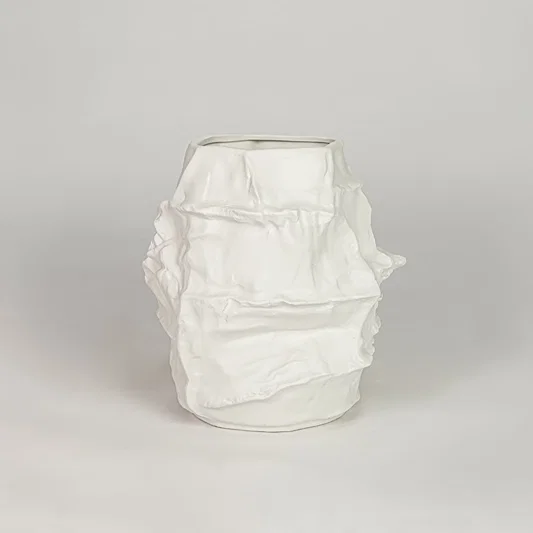 White ceramic decorative flower vase with textured finish modern vase for tabletop shelf console living room decor styling.