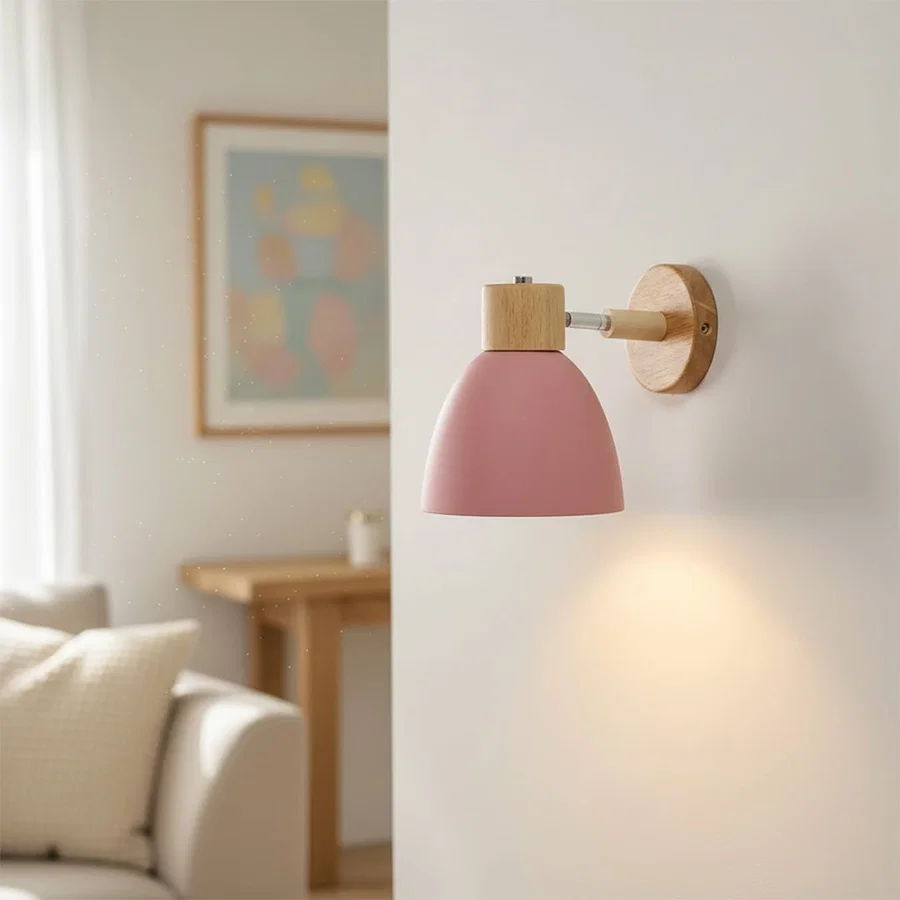 Modern pink wall light with wooden accents creating cozy ambient bedroom lighting decor.