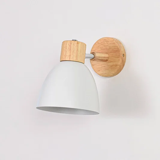 White metal wall light with wooden base switched off on white background showing smooth finish compact form and clean styling.