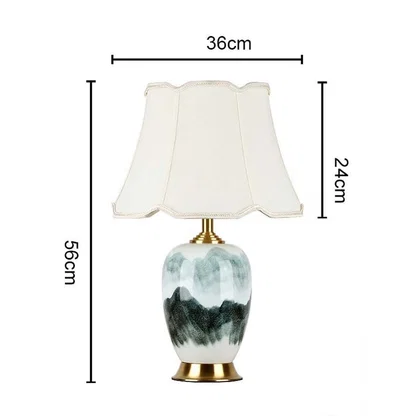 Table lamp light off with white shade and artistic base shown with dimensions 56cm height and 36cm width for product detailing