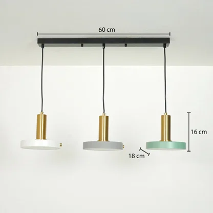 Three-light linear ceiling pendant fixture with black ceiling mount, black cords, gold cylindrical shades, and round white, gray, and mint green lamp shades. Measurement labels show 60 cm width, 16 cm height, and 18 cm shade diameter.