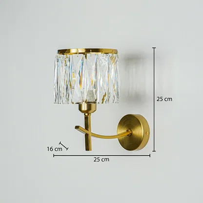 Luxury gold wall light with crystal glass shade mounted on neutral wall background 25 cm height 25 cm width 16 cm depth ideal for elegant interior decor lighting.