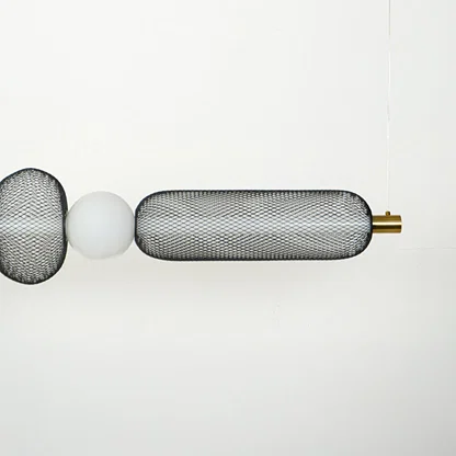 Close view of horizontal wall sconce with ribbed glass shades and metal detailing showcasing premium modern lighting design on clean background.