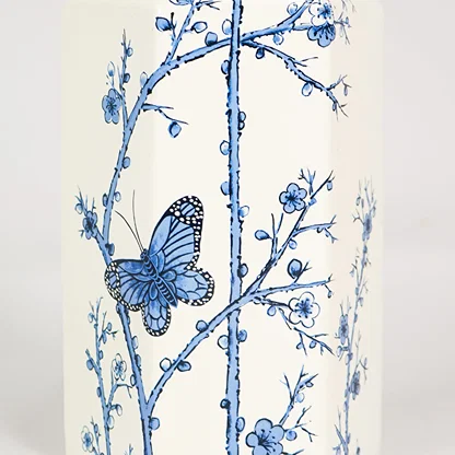 Closeup image of small mediterranean style jar for elegant tabletop decor styling highlighting smooth finish detailing.