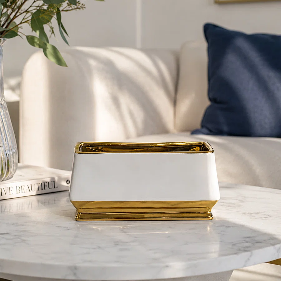 White marble decorative tray with gold frame styled on a coffee table for elegant luxury home decor arrangements.