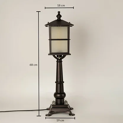 Closeup of outdoor lamp base in black metal finish highlighting sturdy pedestal design durable build and classic detailing.