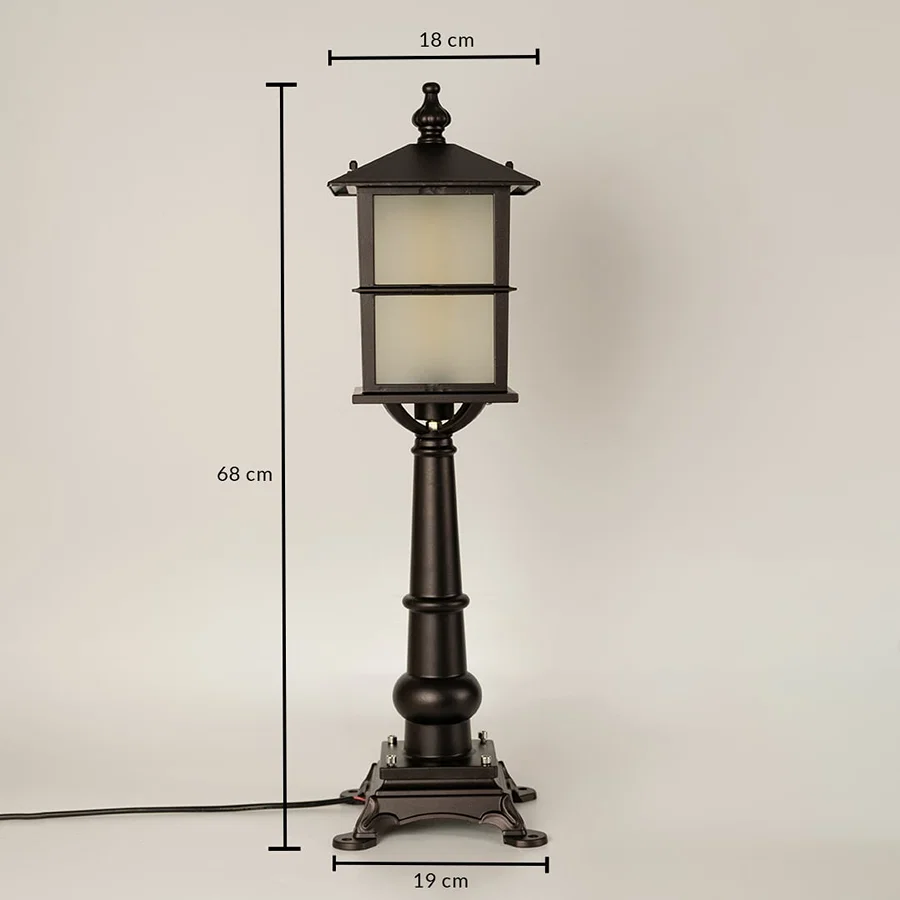 Closeup of outdoor lamp base in black metal finish highlighting sturdy pedestal design durable build and classic detailing.