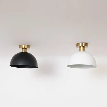 Black and white ceiling lights with gold fittings and dome shades in off mode on white background for stylish home decor.