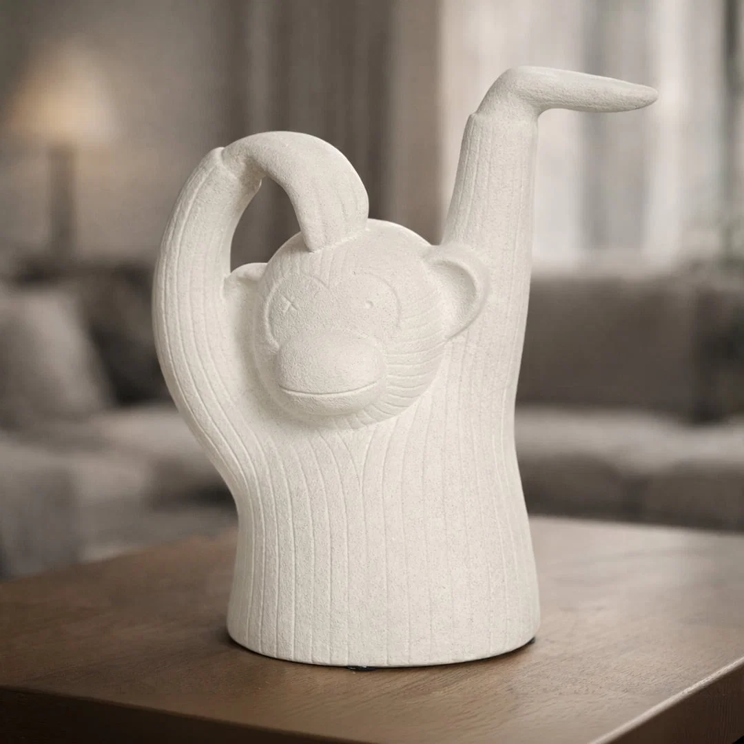 White textured monkey sculpture decor with raised arms playful artistic figurine styled for console table shelf or modern living room decor.