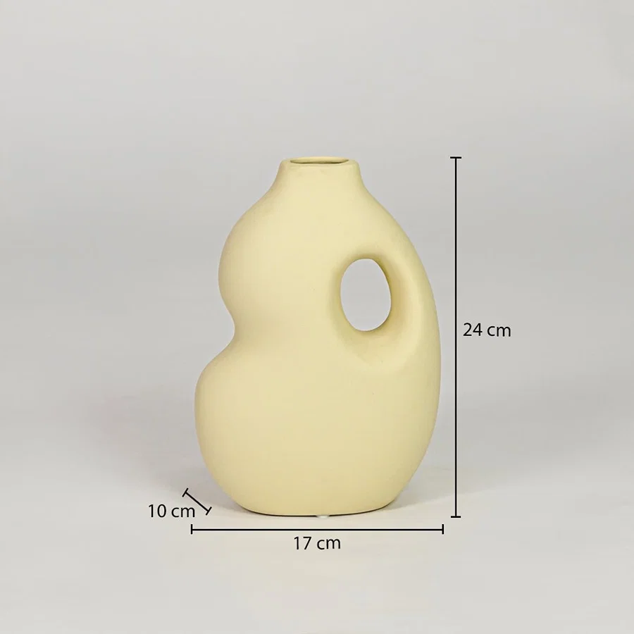 Yellow ceramic decorative vase size 24 cm height 17 cm width 10 cm depth modern designer vase for table console styling.