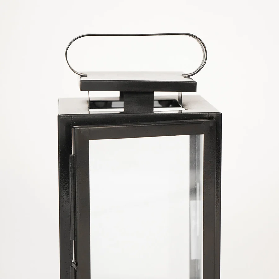 Closeup image of medium metal tower lantern for modern tabletop decor styling with durable sleek metallic finish detailing.