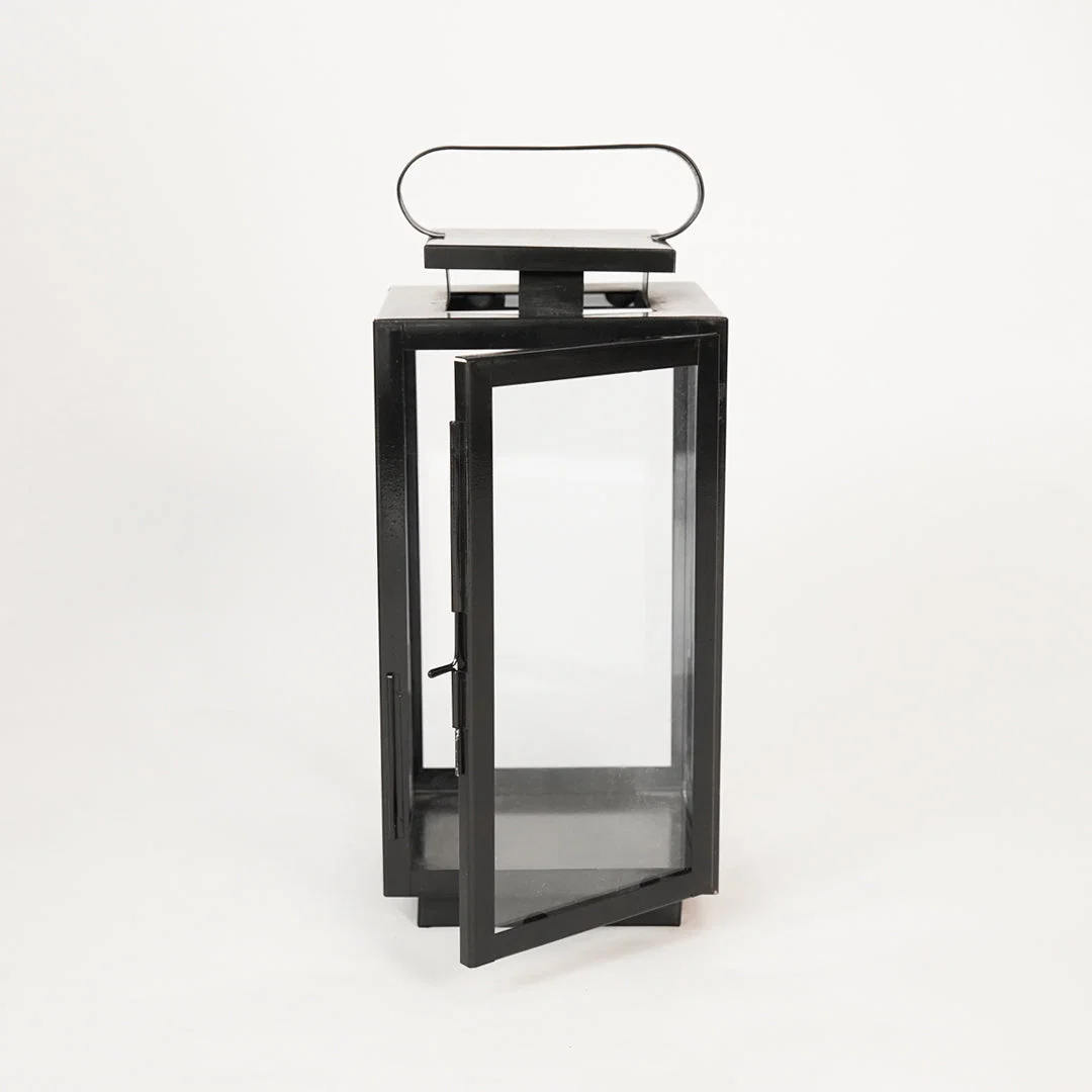 White background image of medium metal tower lantern for modern indoor decor styling with clear glass side panels display.