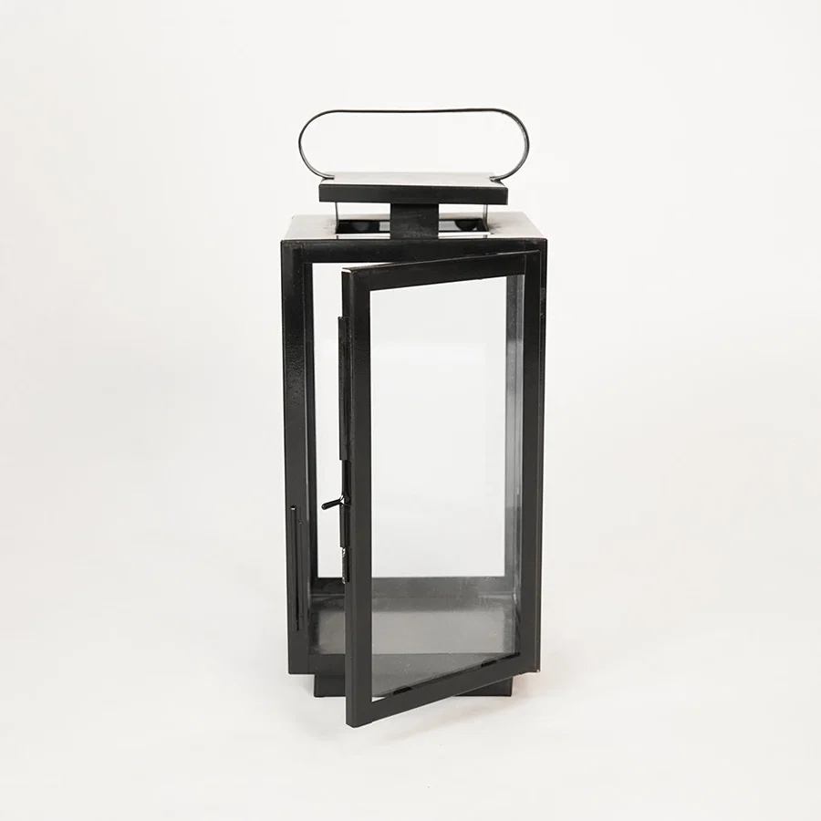 White background image of medium metal tower lantern for modern indoor decor styling with clear glass side panels display.