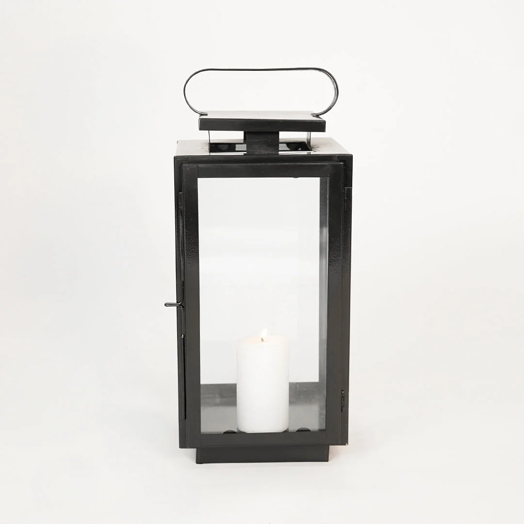 White background image of medium metal tower lantern for elegant table decor styling with sleek metallic finish.