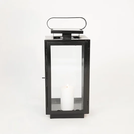 White background image of medium metal tower lantern for elegant table decor styling with sleek metallic finish.