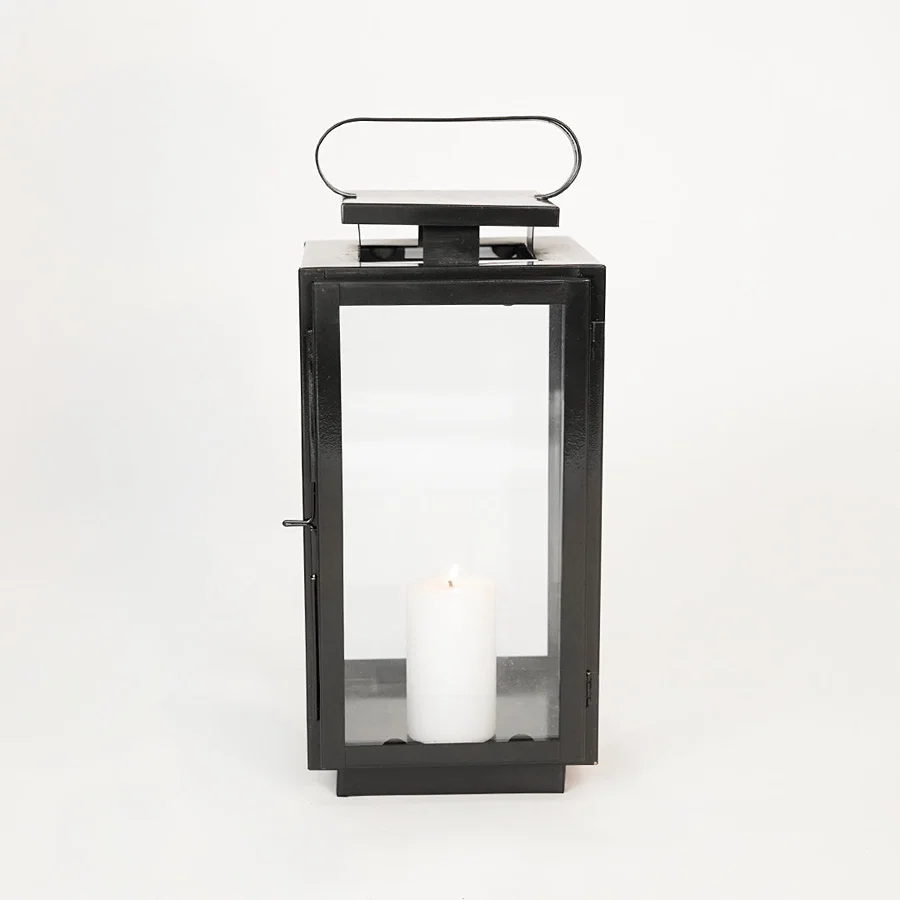 White background image of medium metal tower lantern for elegant table decor styling with sleek metallic finish.