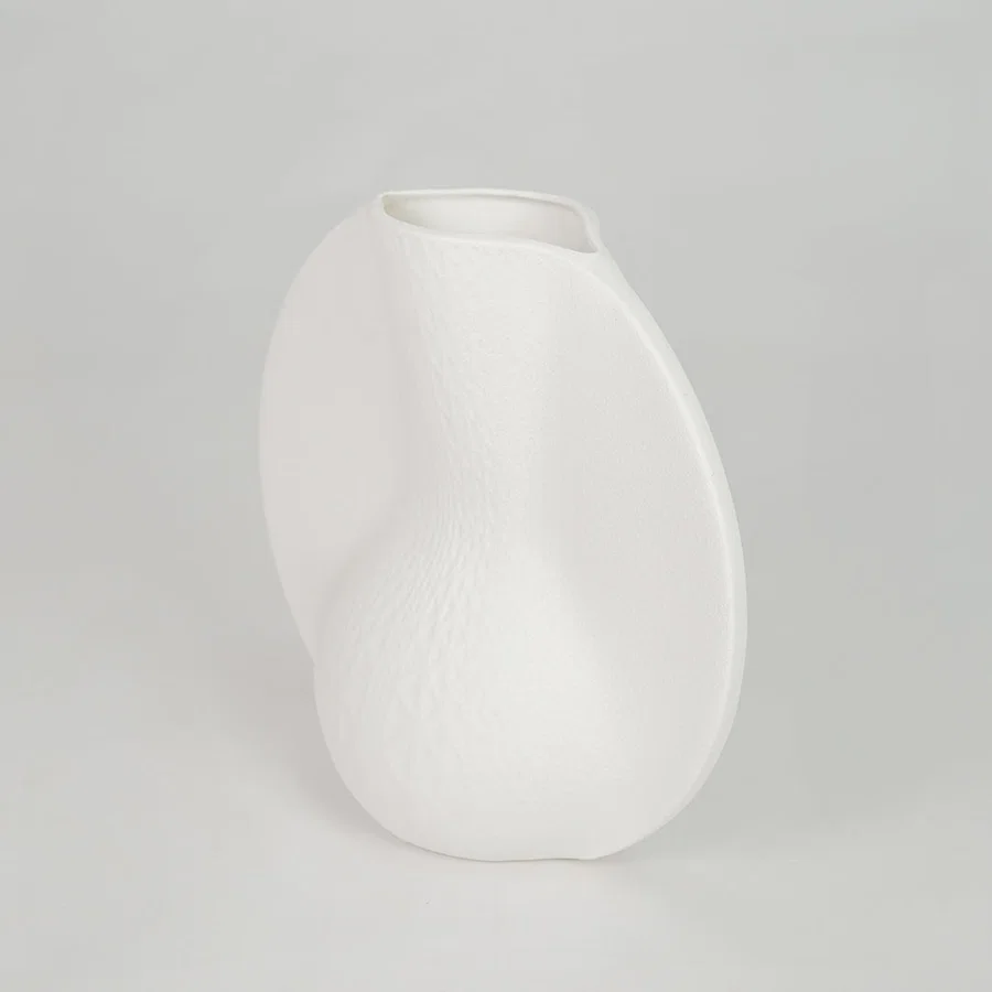 White background image of white ceramic abstract vase for modern tabletop decor styling with matte finish.