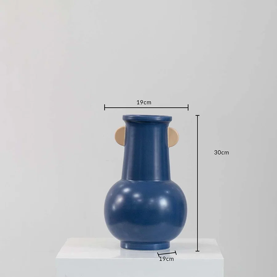 A modern blue vase shown with measurements noting 30 cm height and 19 cm width clearly presenting its size and bold curved design.
